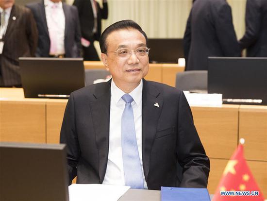 Chinese Premier Li Keqiang addresses the 12th Asia-Europe Meeting (ASEM) Summit in Brussels, Belgium, Oct. 19, 2018. (Xinhua/Huang Jingwen)