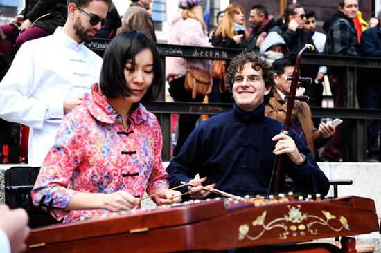 Artists perform traditional Chinese musical instruments in Madrid, Spain, Feb. 11, 2018. (Photo/Xinhua)